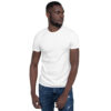 A man wearing jeans and white shirt looking to his left.